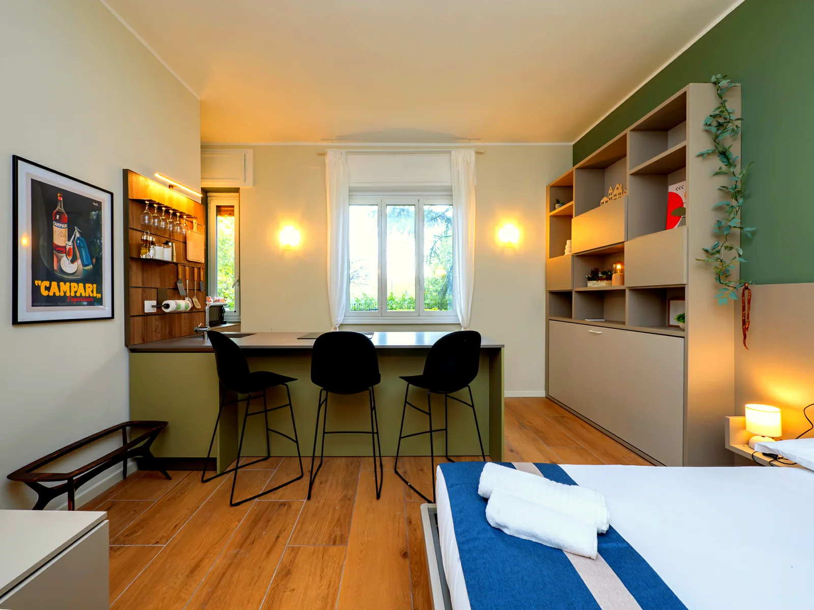 High table and stools by the window: this is where you eat and work